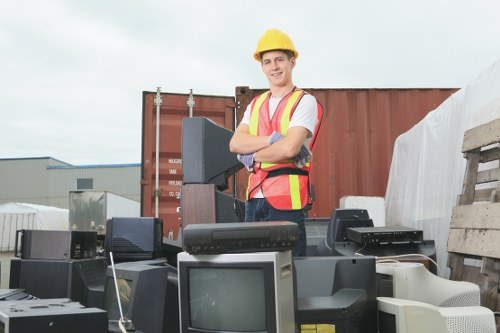 Professional removal service disposing of a mattress